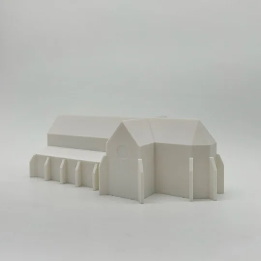 Bílý architektonický model stavby kláštera Porta coeli